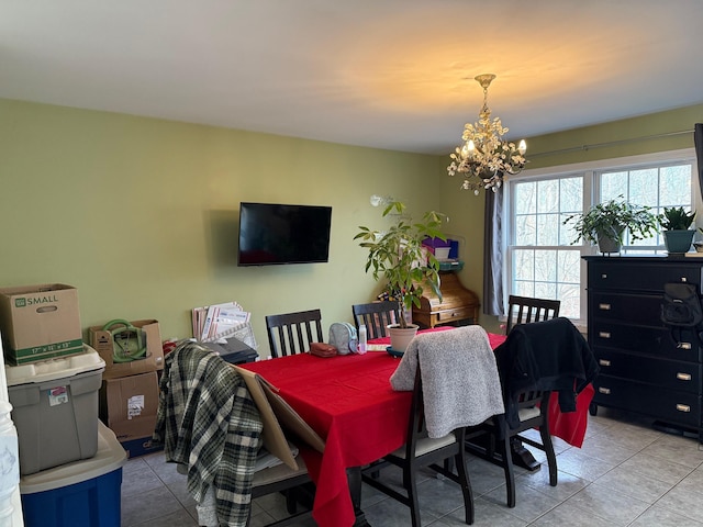 dining room featuring an inviting chandelier and light tile patterned floors