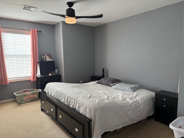 carpeted bedroom with ceiling fan