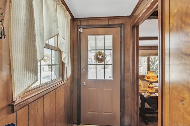 doorway with wooden walls