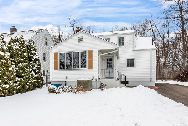 view of snow covered house