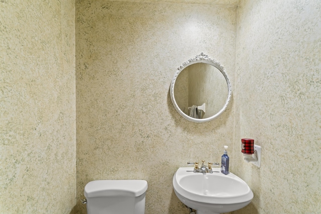 bathroom featuring a sink and toilet