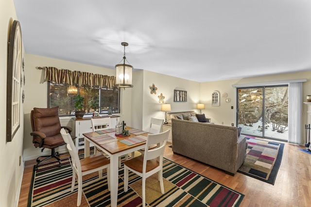 dining room featuring a chandelier and hardwood / wood-style floors