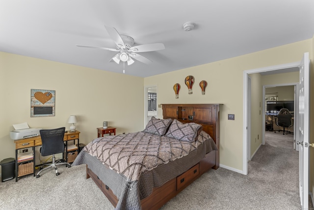 bedroom featuring a ceiling fan, carpet, and baseboards