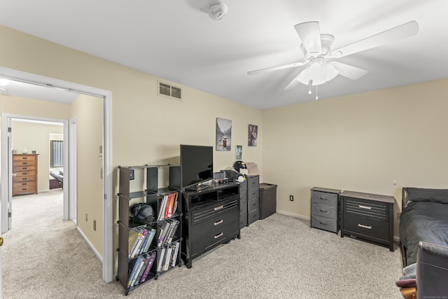 bedroom with light carpet, baseboards, visible vents, and ceiling fan