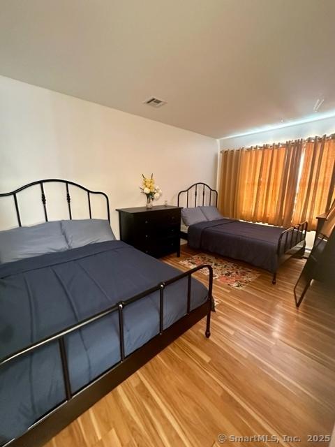 bedroom featuring wood-type flooring