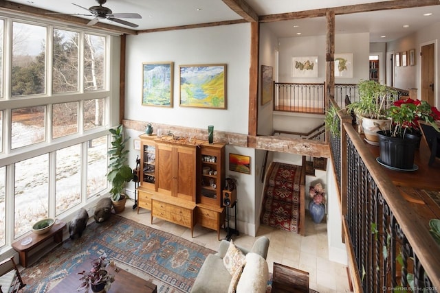 interior space with a wealth of natural light and ceiling fan