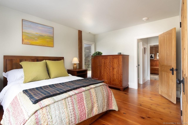 bedroom with wood-type flooring