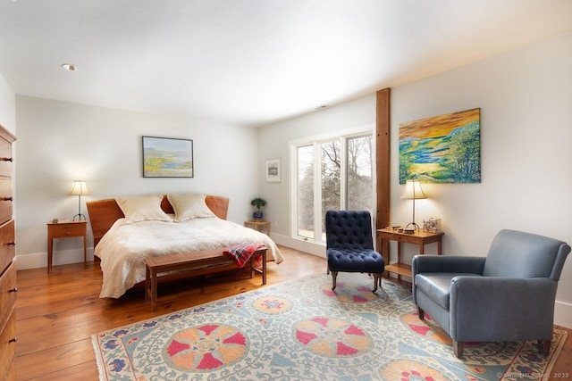 bedroom with hardwood / wood-style floors