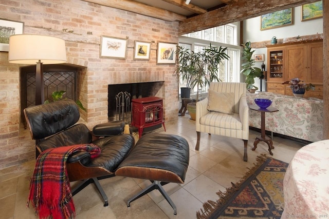 living area with beam ceiling, tile patterned floors, and brick wall