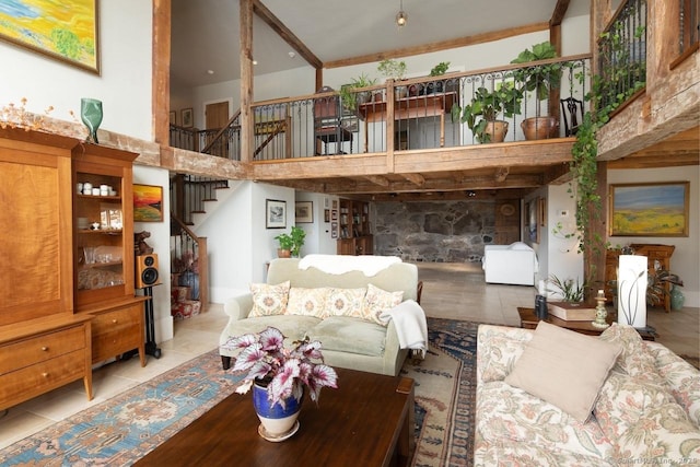 living room featuring a high ceiling and light tile patterned flooring