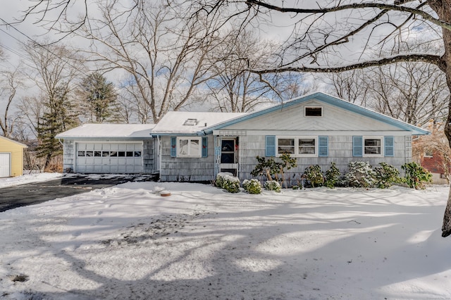 view of front of property with driveway and an attached garage