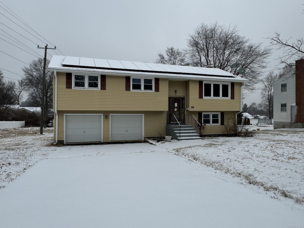 bi-level home featuring a garage