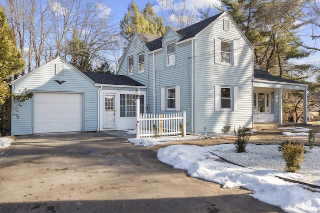 view of front of house featuring a porch and a garage