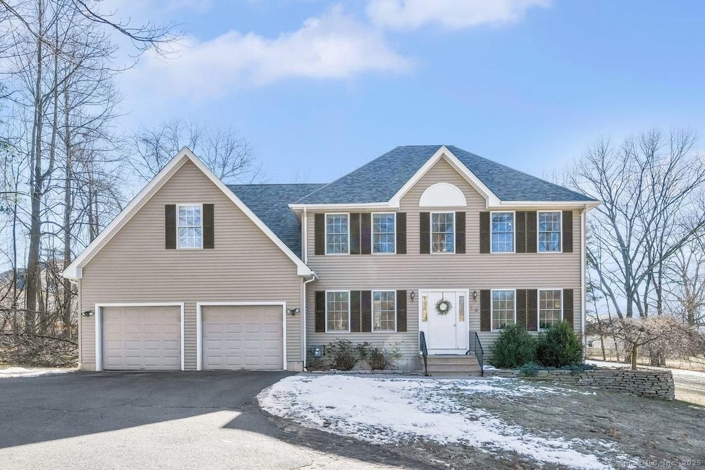 colonial-style house featuring a garage