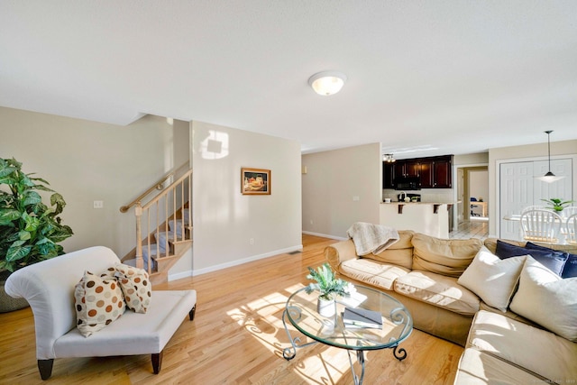 living room with light hardwood / wood-style flooring