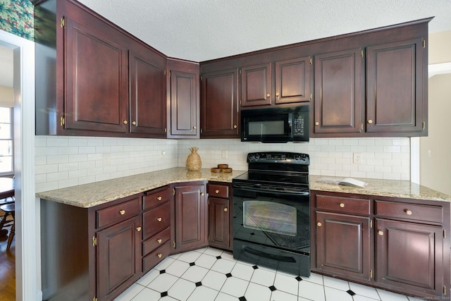 kitchen featuring tasteful backsplash, light stone countertops, black appliances, and a textured ceiling