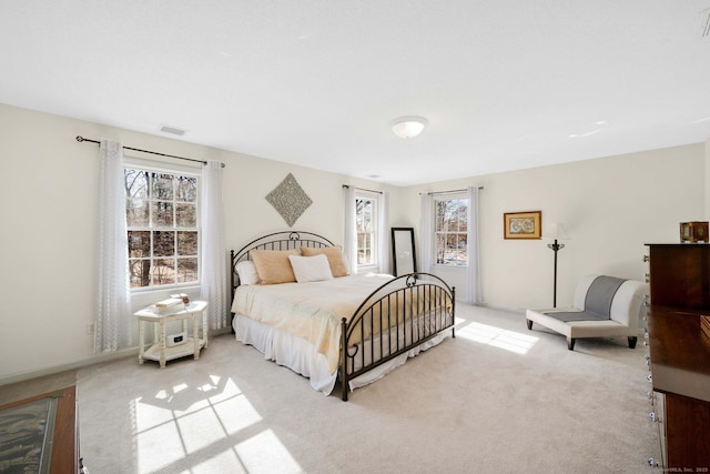 bedroom with light carpet