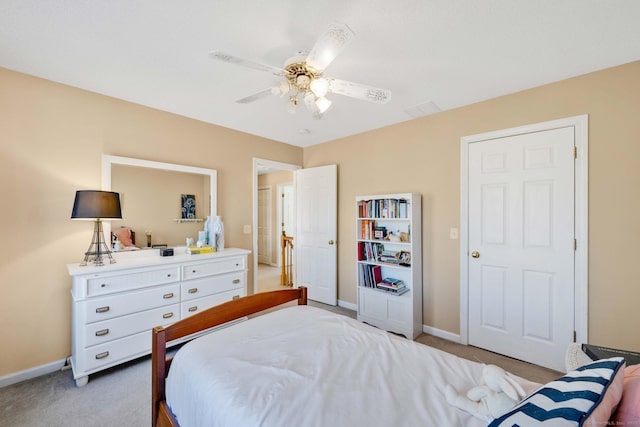 bedroom featuring light carpet and ceiling fan