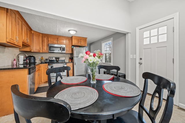 dining area featuring sink