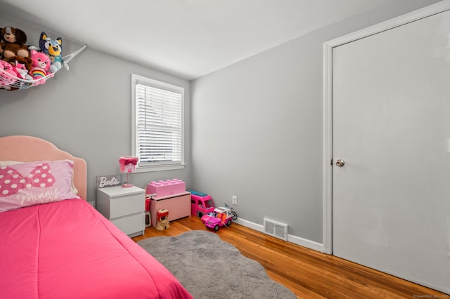 bedroom with light wood-type flooring