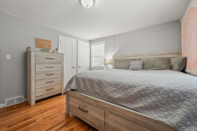 bedroom with wood-type flooring