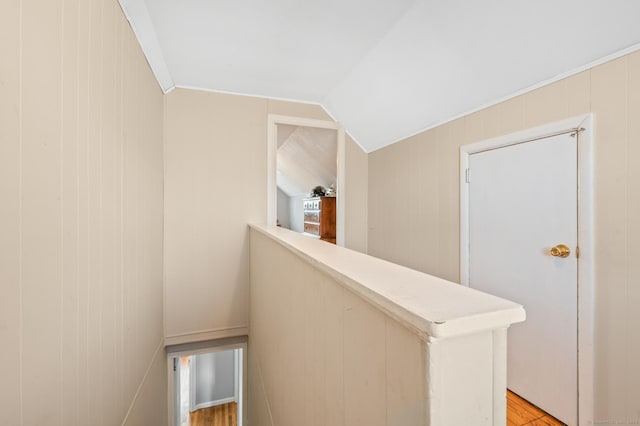 hallway featuring vaulted ceiling