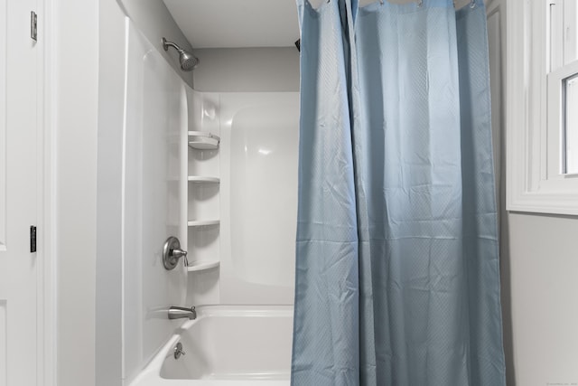 bathroom featuring shower / tub combo with curtain