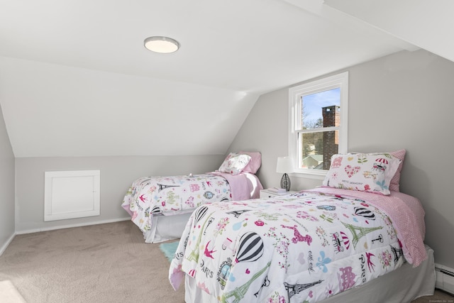 carpeted bedroom featuring baseboard heating and vaulted ceiling