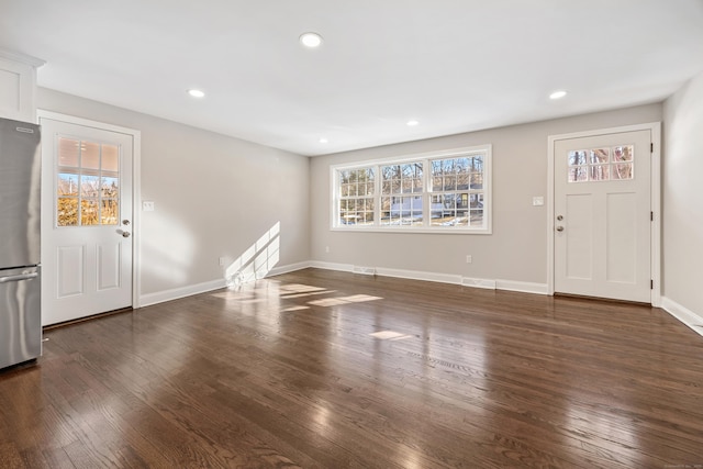 foyer entrance featuring dark hardwood / wood-style floors