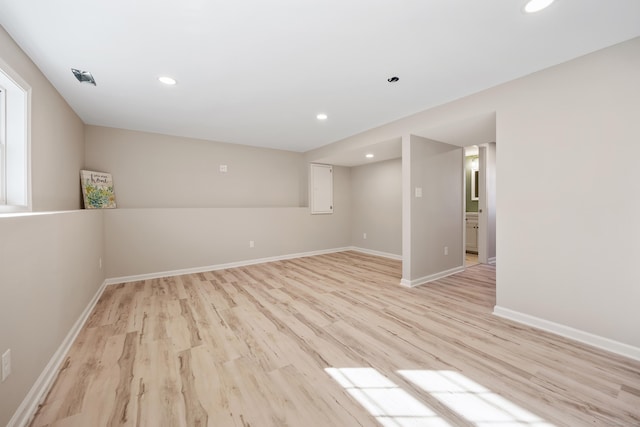 spare room with light hardwood / wood-style floors