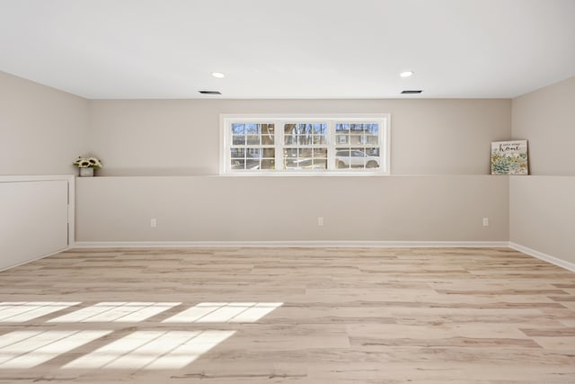 spare room featuring light hardwood / wood-style floors