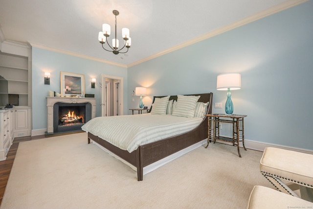 bedroom with baseboards, a lit fireplace, an inviting chandelier, and ornamental molding