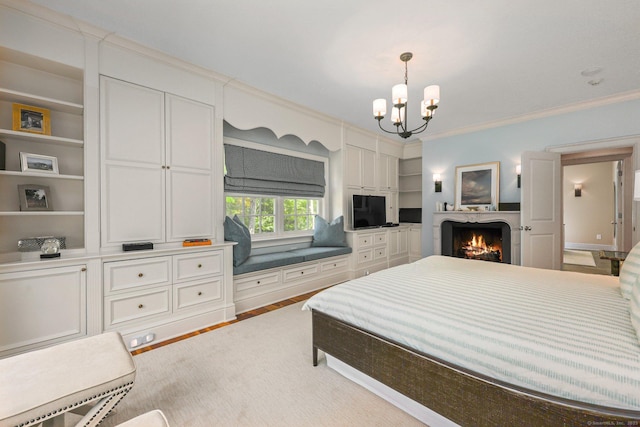 bedroom featuring crown molding, wood finished floors, a warm lit fireplace, and a chandelier