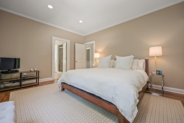 bedroom featuring recessed lighting, wood finished floors, baseboards, and ornamental molding