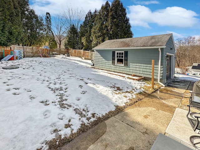 snowy yard with a playground