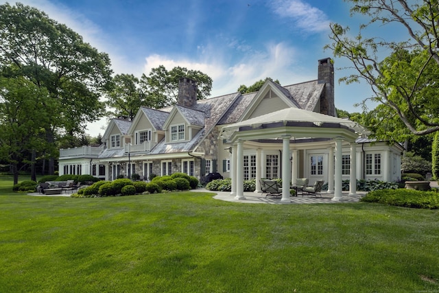 109 Elys Ferry Rd, Lyme, CT 06371 - back of house with a chimney, a patio, a lawn, and an outdoor living space