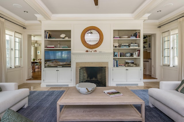 109 Elys Ferry Rd, Lyme, CT 06371 - living area with ornamental molding, plenty of natural light, built in features, and a fireplace
