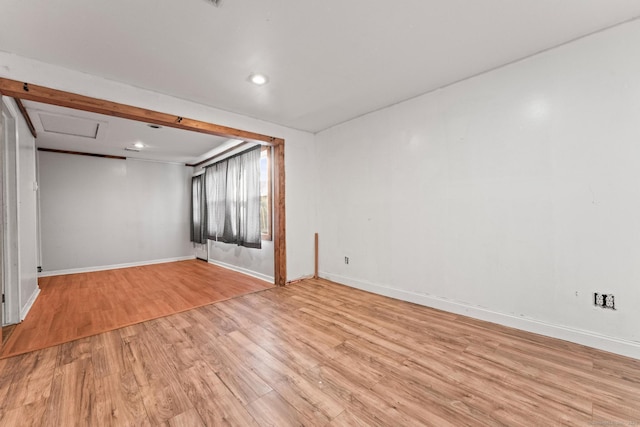 spare room featuring light wood-type flooring