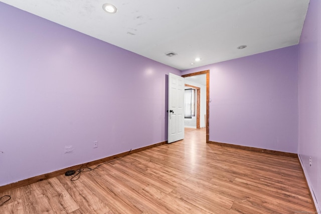 empty room with light hardwood / wood-style floors