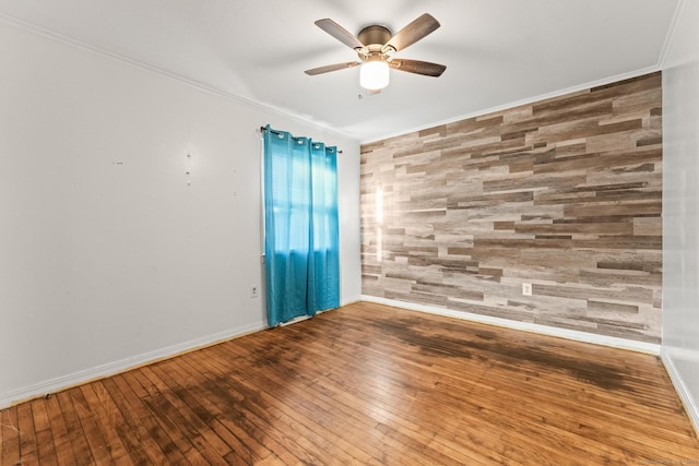 unfurnished room featuring crown molding, hardwood / wood-style floors, and ceiling fan