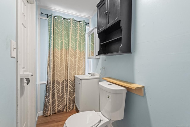 bathroom featuring sink, hardwood / wood-style flooring, and toilet