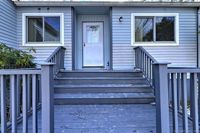 doorway to property featuring a wooden deck