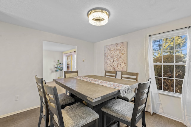 dining space with dark hardwood / wood-style floors