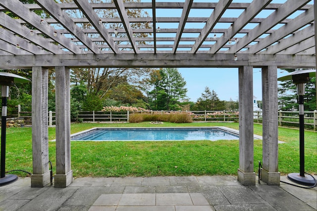 view of swimming pool featuring a lawn, a fenced in pool, and a pergola