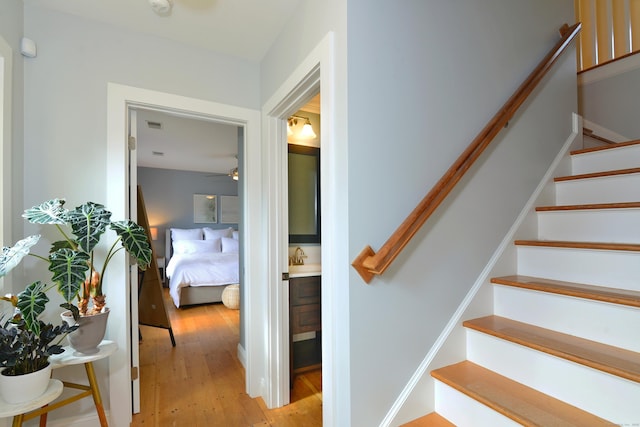 staircase with wood finished floors