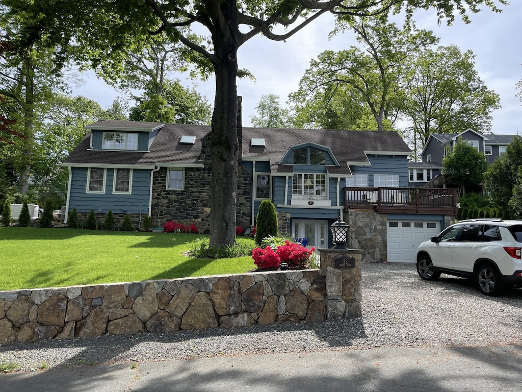 view of front of house with a garage and a front yard