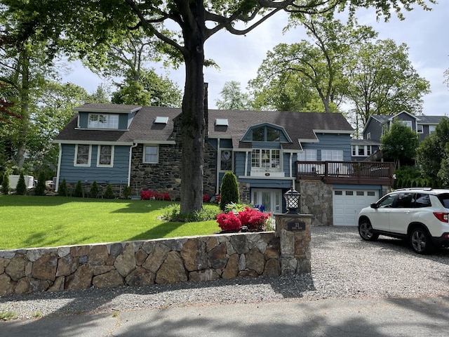 view of front of house with a garage and a front yard