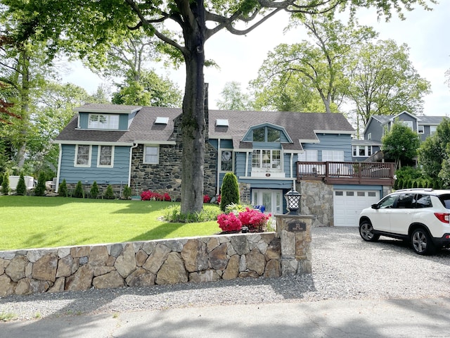 view of front of property with a garage and a front yard