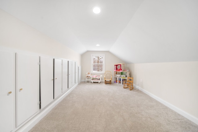 game room featuring recessed lighting, light carpet, vaulted ceiling, and baseboards