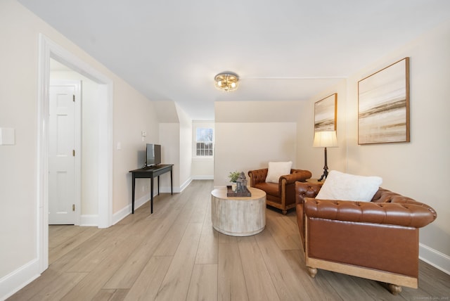 interior space with light wood-type flooring and baseboards